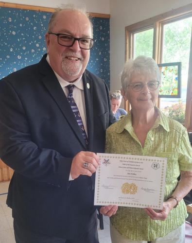 Bro. Ken Conrod PGP presents a 50 year certificate to Sr. Jane Wallace, PM [Presented July 2023]
